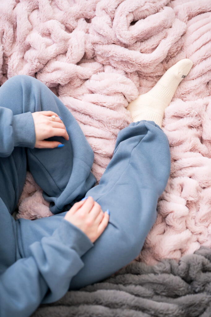 Woman lounging on Milan minky in Comfrt sweatpants